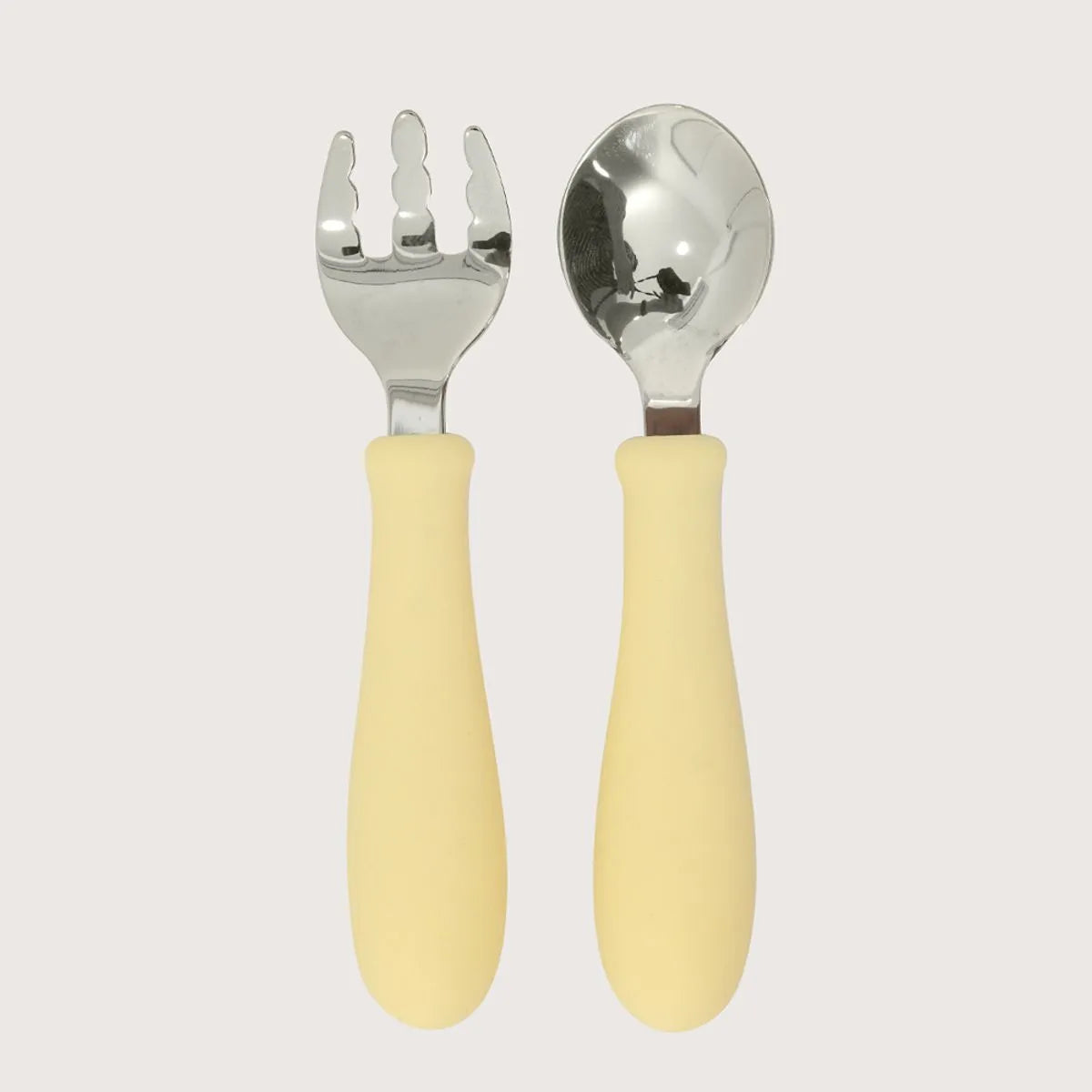 Set cuchara y tenedor silicona acero giratorios amarillo